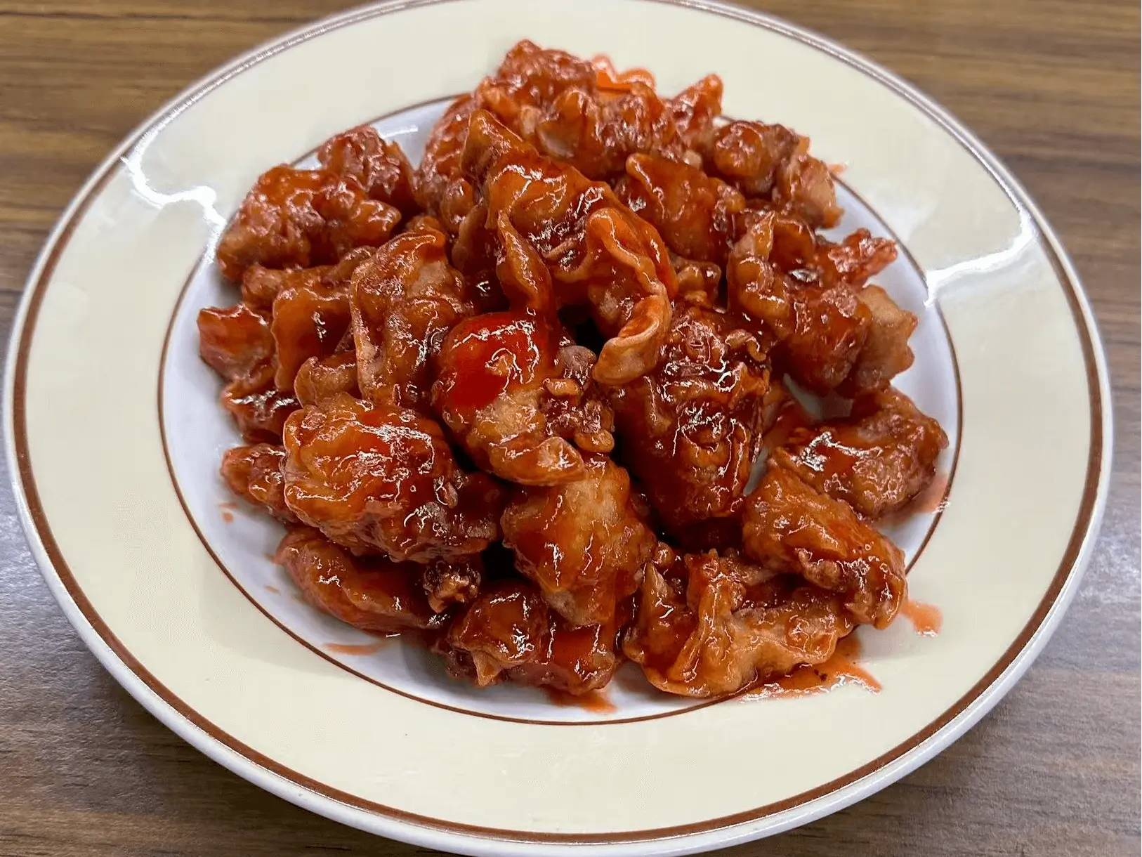 Crispy pork coated in sweet and sour sauce at The Top Restaurant And Lounge, a Chinese Restaurant in Clinton