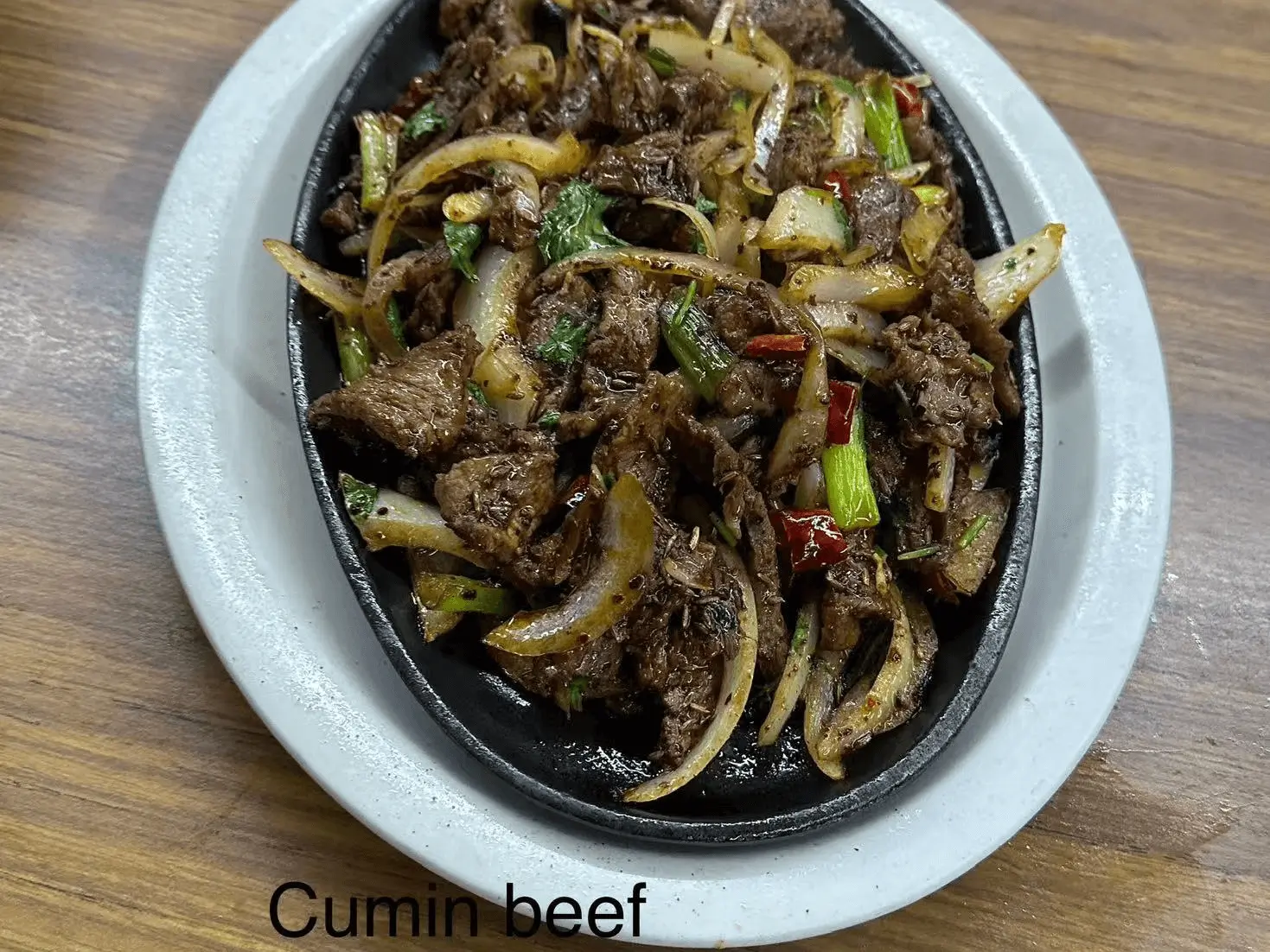 Tender beef stir - fried with cumin, onion and chili at The Top Restaurant And Lounge, a Chinese Restaurant in Clinton
