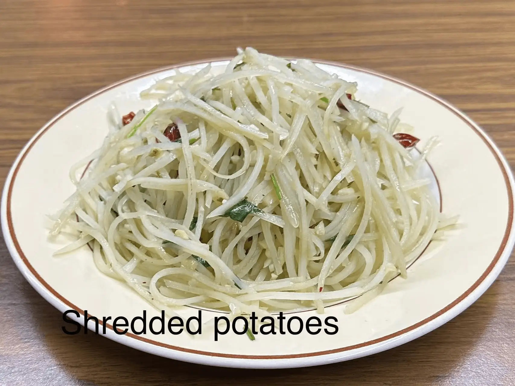 Shredded potatoes stir - fried with chili and herbs at The Top Restaurant And Lounge, a Chinese Restaurant in Clinton