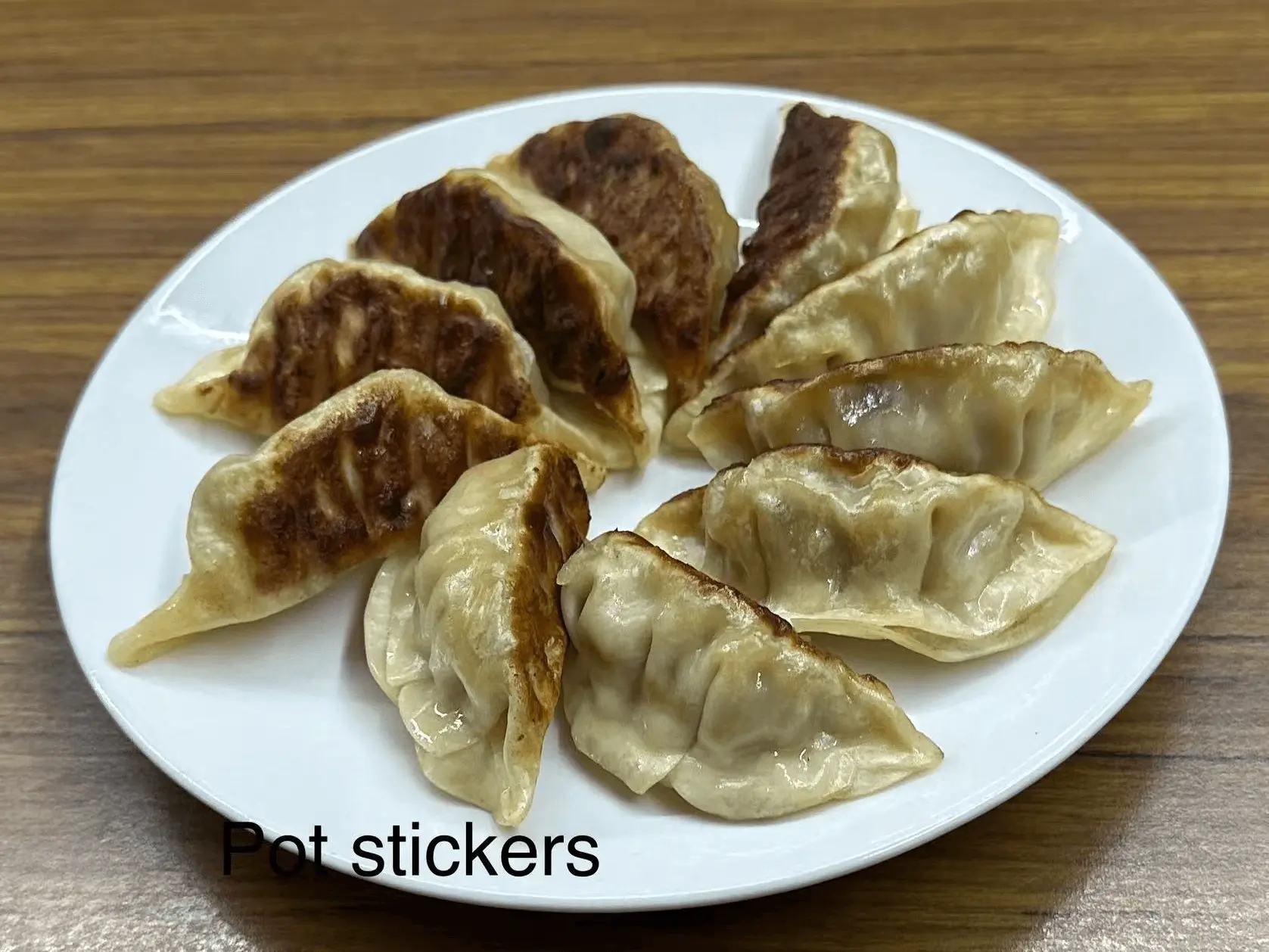 Pan - fried dumplings with savory filling at The Top Restaurant And Lounge, a Chinese Restaurant in Clinton