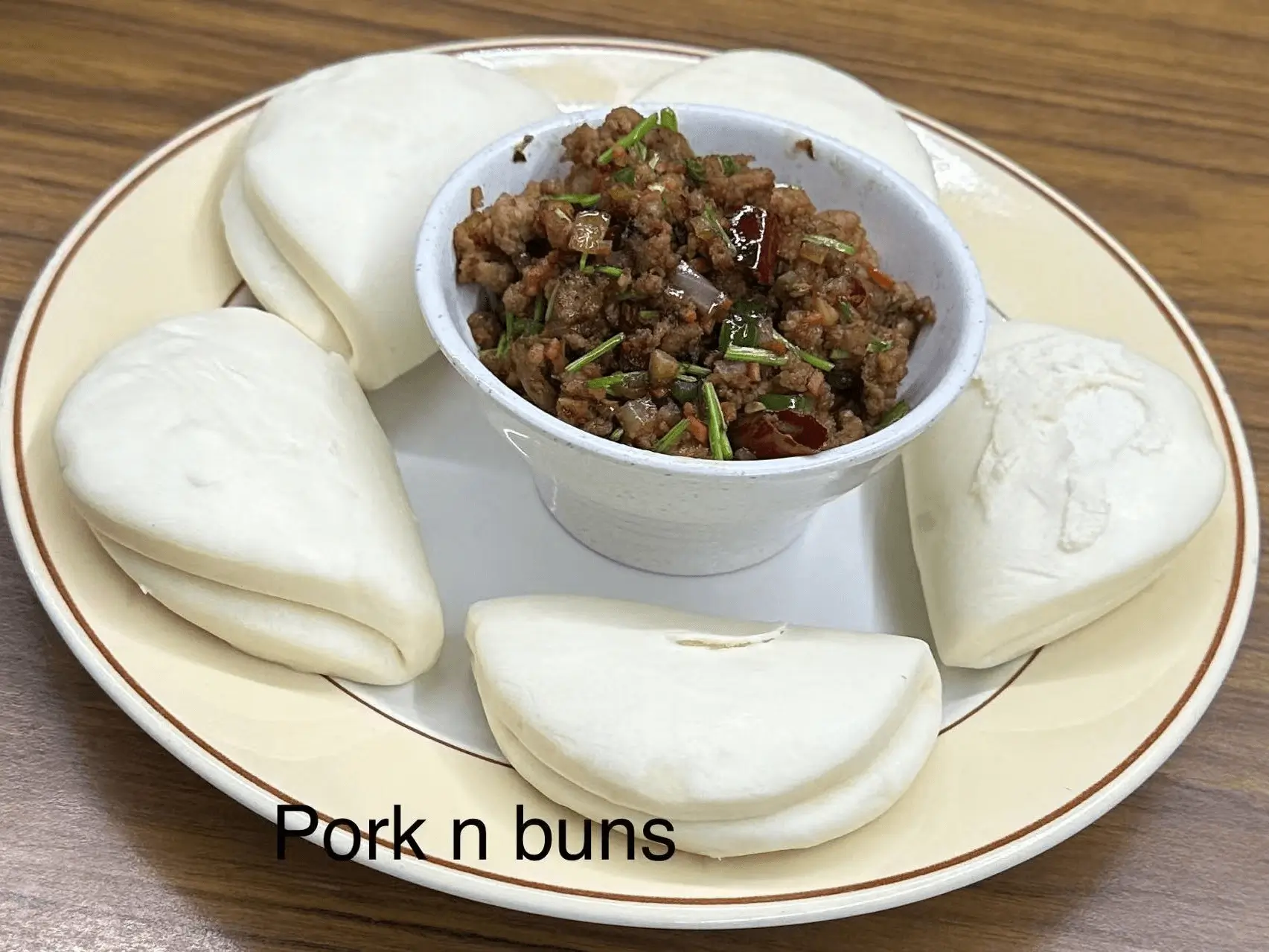 Soft buns served with flavorful minced pork at The Top Restaurant And Lounge, a Chinese Restaurant in Clinton